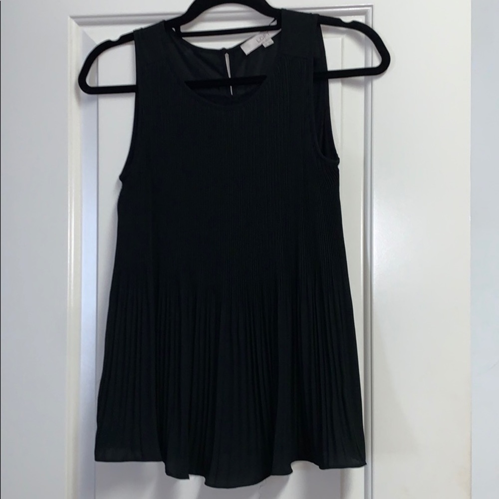 Sleeveless blouse with adorable front detail.